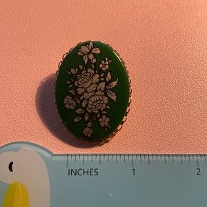Green floral brooch